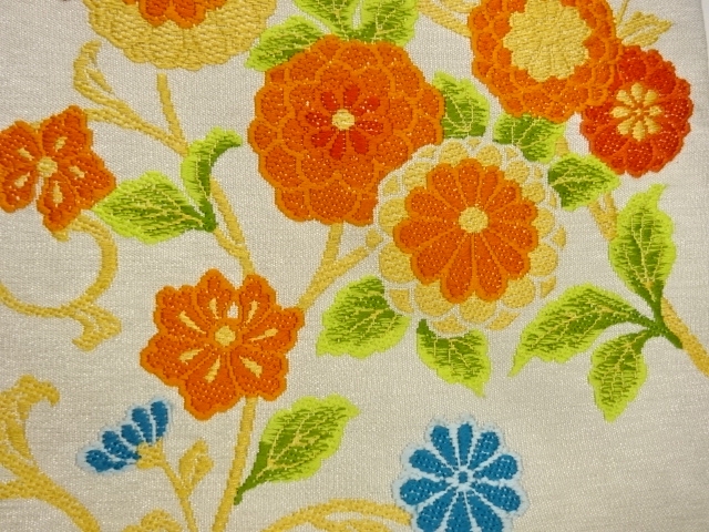  菊唐草模様織出し名古屋帯